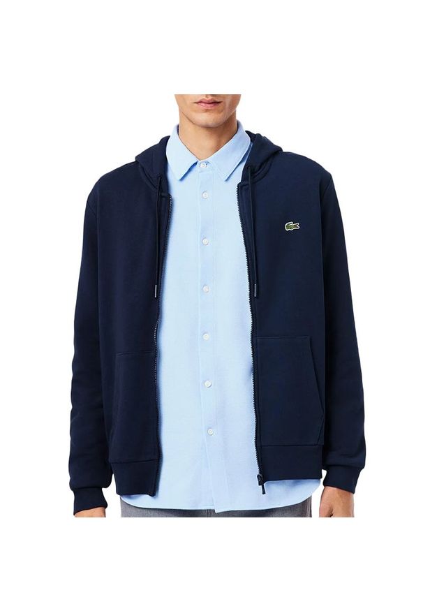 Bluza męska Lacoste Classic Fit SH9809-166 - granatowa. Okazja: na co dzień. Kolor: niebieski. Materiał: bawełna. Wzór: aplikacja. Styl: casual, street, sportowy, elegancki. Sport: fitness