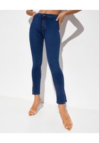 FREE PEOPLE - Spodnie jeansowe z rozcięciem Riley Slit. Kolor: niebieski. Długość: długie