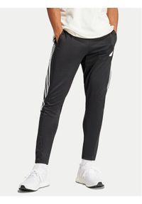 Adidas - adidas Spodnie dresowe Tiro IP3778 Czarny Regular Fit. Kolor: czarny. Materiał: bawełna