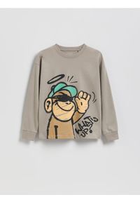 Reserved - Longsleeve z nadrukiem - beżowy. Kolor: beżowy. Materiał: bawełna, dzianina. Długość rękawa: długi rękaw. Wzór: nadruk #1