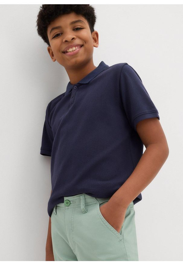 bonprix - Spodnie chino z bawełny ze stretchem, Slim Fit. Kolor: zielony. Materiał: bawełna