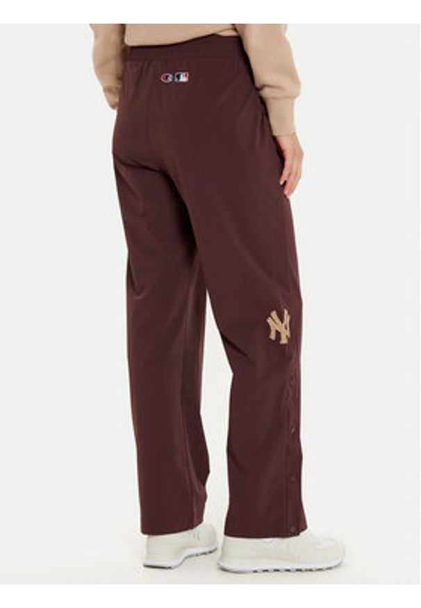 Champion Spodnie dresowe 117511 Brązowy Wide Leg. Kolor: brązowy. Materiał: syntetyk