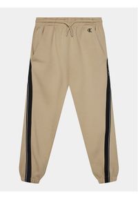 Calvin Klein Jeans Spodnie dresowe Interlock IB0IB01931 Beżowy Relaxed Fit. Kolor: beżowy. Materiał: bawełna #1
