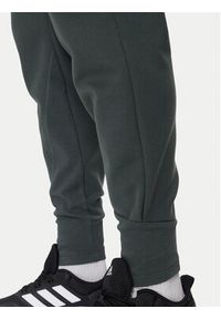 Adidas - adidas Spodnie dresowe Z.N.E. Winterized IR5244 Zielony Regular Fit. Kolor: zielony. Materiał: syntetyk
