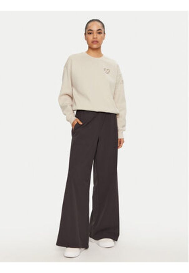 Champion Spodnie dresowe 117472 Czarny Wide Leg. Kolor: czarny. Materiał: syntetyk