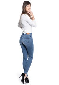 Wrangler - SPODNIE DAMSKIE WRANGLER SKINNY HIGH RISE WONDER BLUE W27HJR211