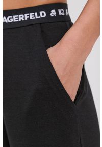 Karl Lagerfeld Spodnie piżamowe damskie kolor czarny. Kolor: czarny. Materiał: bawełna, materiał, dzianina, lyocell, tkanina, jedwab. Wzór: melanż #2