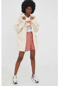 New Balance kurtka damska kolor beżowy przejściowa oversize. Kolor: beżowy. Materiał: bawełna. Długość rękawa: raglanowy rękaw. Długość: długie