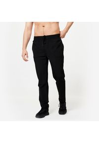 DOMYOS - Spodnie fitness męskie Domyos. Kolor: czarny. Materiał: elastan, poliester, materiał. Sport: fitness #1