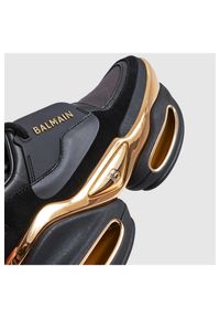 Balmain - BALMAIN Sneakersy skórzane damskie czarno-złote B-Bold. Kolor: czarny. Materiał: skóra