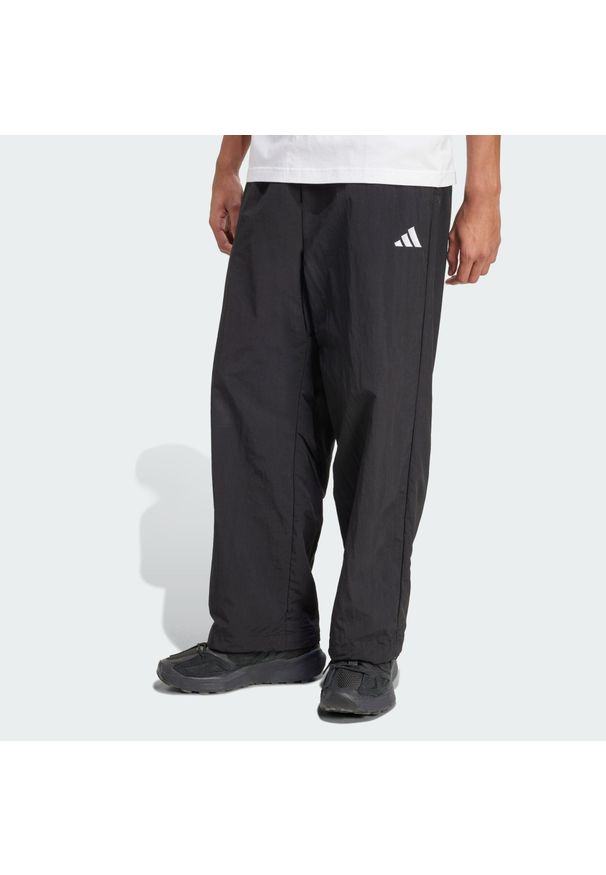 Adidas - Spodnie Essential Small Logo Woven Open Hem. Kolor: czarny, biały, wielokolorowy. Materiał: tkanina. Sport: fitness