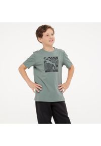 Koszulka dziecięca Puma. Kolor: zielony. Materiał: bawełna