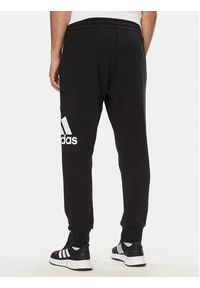 Adidas - adidas Spodnie dresowe Essentials French Terry Tapered Cuff Logo Joggers HA4342 Czarny Regular Fit. Kolor: czarny. Materiał: bawełna