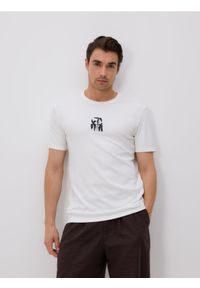 Reserved - T-shirt regular z nadrukiem - złamana biel. Materiał: bawełna, dzianina. Wzór: nadruk