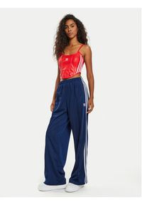 Adidas - adidas Spodnie dresowe Firebird IL3817 Granatowy Loose Fit. Kolor: niebieski. Materiał: syntetyk #5