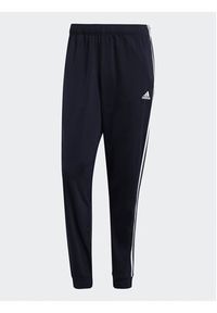Adidas - adidas Spodnie dresowe Essentials Warm-Up 3-Stripes H46106 Granatowy Regular Fit. Kolor: niebieski. Materiał: syntetyk #5