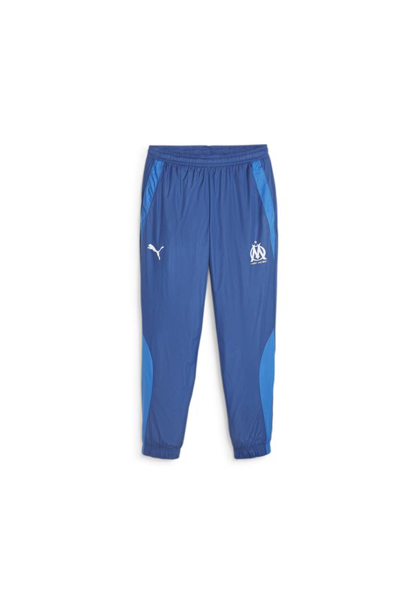 Puma - Tkane spodnie dresowe Prematch om 2023/24. Kolor: niebieski. Materiał: dresówka. Sport: piłka nożna
