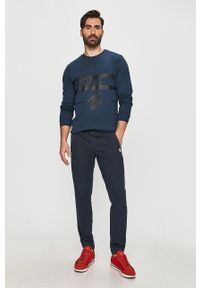Tommy Jeans - Spodnie. Kolor: niebieski. Materiał: tkanina, bawełna, elastan. Wzór: gładki #4