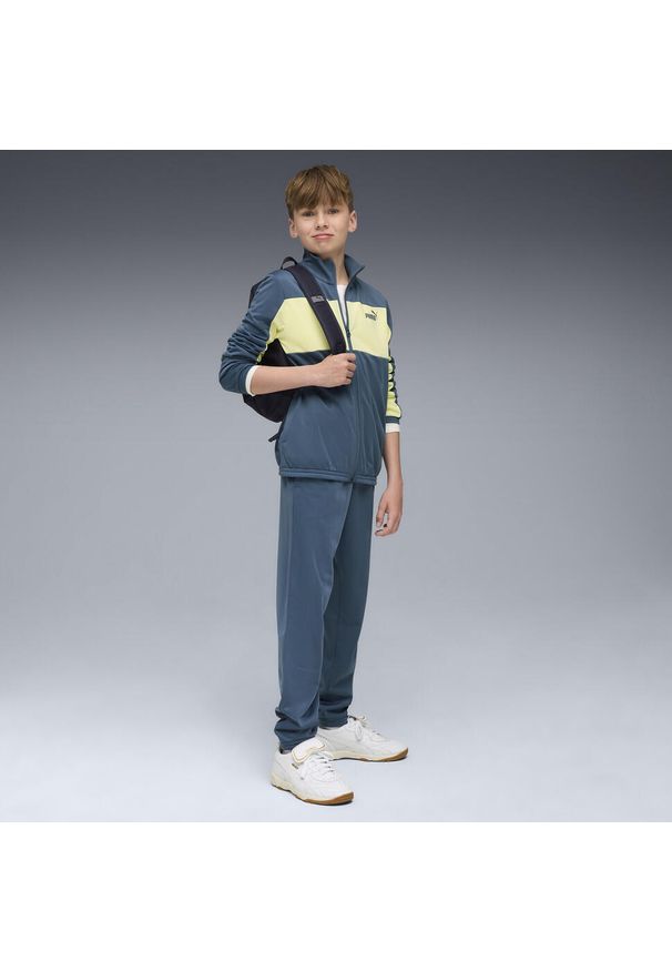 Puma - Młodzieżowy dres PUMA z poliestru z blokami kolorów PUMA. Okazja: na uczelnię. Kolor: niebieski. Materiał: poliester, dresówka. Wzór: nadruk. Styl: młodzieżowy