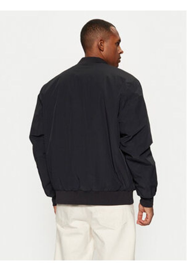 Champion Kurtka bomber 220344 Czarny Regular Fit. Kolor: czarny. Materiał: syntetyk