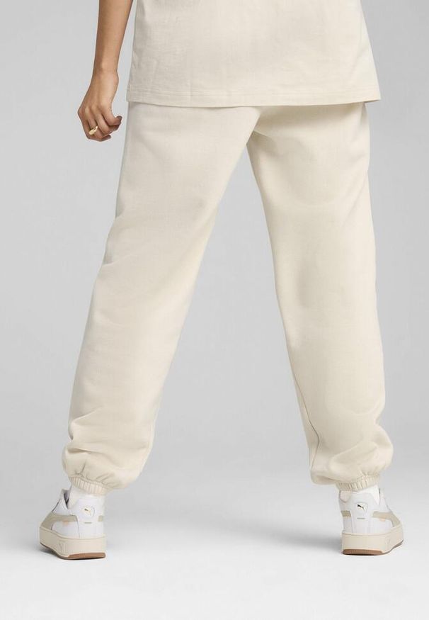 Puma - Spodnie dresowe unisex Essentials Elevated PUMA Alpine Snow White. Kolor: biały. Materiał: dresówka