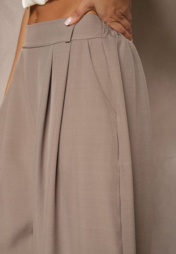 Renee - Jasnobrązowe Eleganckie Spodnie Palazzo z Szerokimi Nogawkami Adivisa. Stan: podwyższony. Kolor: beżowy. Styl: elegancki