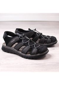 Komfortowe sandały męskie zabudowane czarne Rieker 26770-00. Kolor: czarny. Materiał: skóra ekologiczna