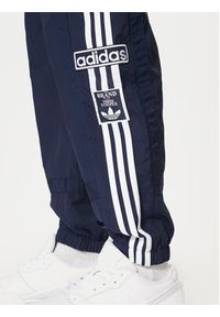 Adidas - adidas Spodnie dresowe Adibreak JD4258 Granatowy Loose Fit. Kolor: niebieski. Materiał: syntetyk #4