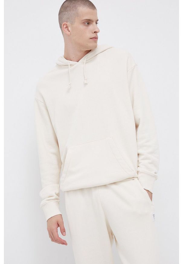 Reebok Classic - Bluza bawełniana. Okazja: na co dzień. Typ kołnierza: kaptur. Kolor: beżowy. Materiał: bawełna. Wzór: gładki. Styl: casual