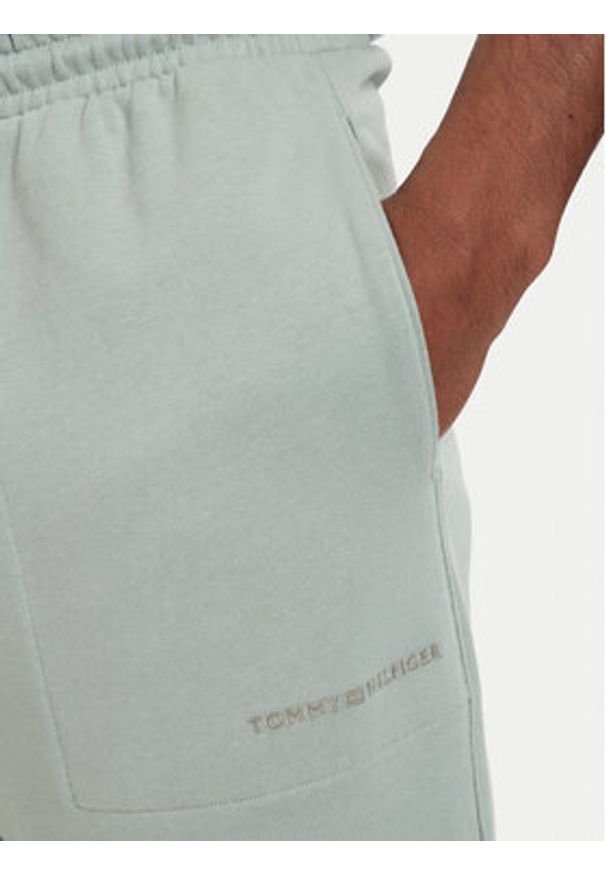 TOMMY HILFIGER - Tommy Hilfiger Spodnie dresowe Essential UM0UM03911 Zielony jasny Relaxed Fit. Kolor: zielony. Materiał: bawełna