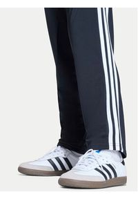 Adidas - adidas Spodnie dresowe Firebird Track KE0910 Czarny Regular Fit. Kolor: czarny. Materiał: syntetyk #2