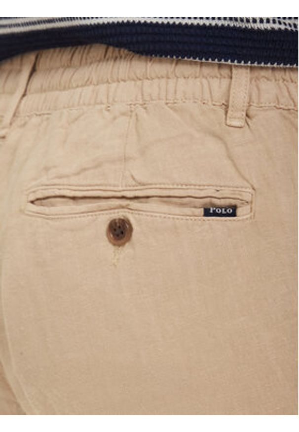 Polo Ralph Lauren Spodnie materiałowe 710940611010 Beżowy jasny Tapered Fit. Kolor: beżowy. Materiał: len