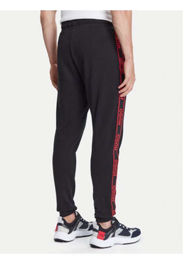 Hugo - HUGO Spodnie dresowe Liam 50540918 Czarny Regular Fit. Kolor: czarny. Materiał: bawełna