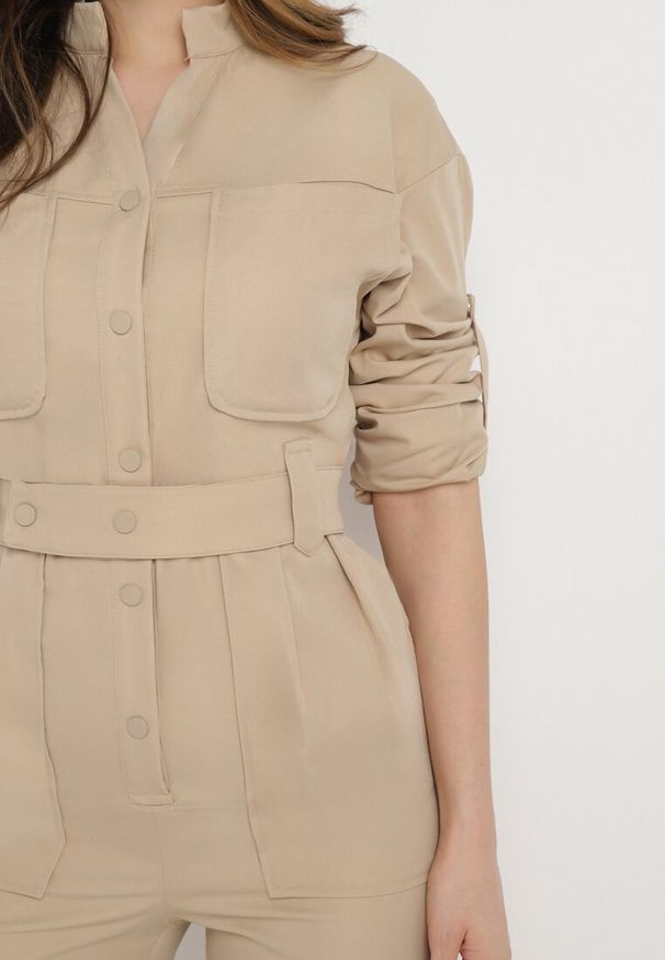 Born2be - Ciemnobeżowy Długi Kombinezon w Rustykalnym Stylu z Paskiem Orilena. Kolor: beżowy. Materiał: materiał. Długość: długie. Styl: sportowy