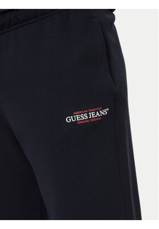 Guess Jeans Spodnie dresowe M4YB18 K9V31 Granatowy Regular Fit. Kolor: niebieski. Materiał: bawełna