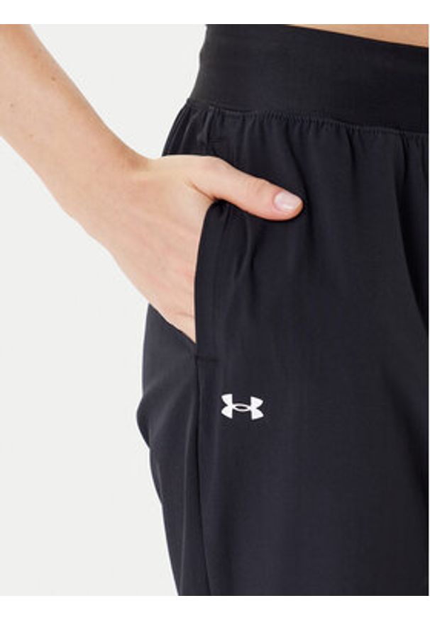 Under Armour Spodnie dresowe Armoursport High Rise Wvn Pnt 1382727-001 Czarny Loose Fit. Kolor: czarny. Materiał: syntetyk
