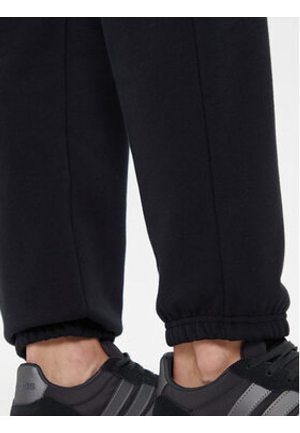 Under Armour Spodnie dresowe Ua Icon 6003676 Czarny Loose Fit. Kolor: czarny. Materiał: syntetyk
