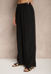 Renee - Czarne Spodnie Palazzo o Szerokim Kroju High Waist Ollevia. Okazja: na co dzień, na spotkanie biznesowe. Stan: podwyższony. Kolor: czarny. Materiał: jedwab. Wzór: aplikacja. Styl: biznesowy, elegancki, casual