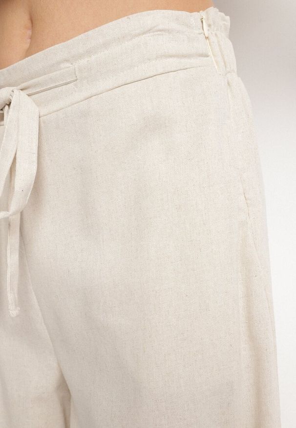 Born2be - Beżowe Szerokie Spodnie z Bawełny z Wysokim Stanem z Troczkiem Nelseli. Okazja: na co dzień. Stan: podwyższony. Kolor: beżowy. Materiał: bawełna. Styl: casual