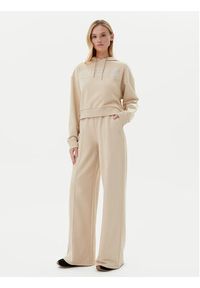 Guess Spodnie dresowe V5GB07 KCRP0 Beżowy Regular Fit. Kolor: beżowy. Materiał: bawełna