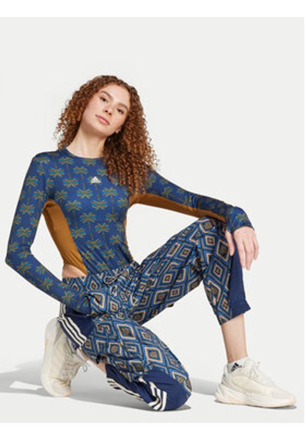Adidas - adidas Spodnie dresowe FARM Rio Premium IV9760 Granatowy Loose Fit. Kolor: niebieski. Materiał: syntetyk
