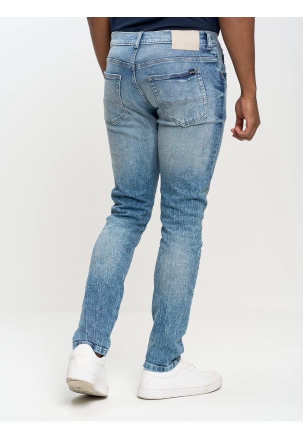 Big-Star - Jeansy męskie skinny z przetarciami niebieskie Owen 141. Okazja: na co dzień. Stan: obniżony. Kolor: niebieski. Wzór: kratka. Styl: sportowy, klasyczny, retro, casual