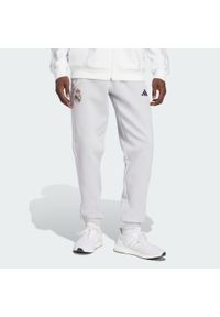 Adidas - Spodnie Real Madrid UBP Doubleknit. Kolor: biały, wielokolorowy, szary. Sport: piłka nożna