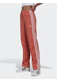 Adidas - Spodnie dresowe adidas. Kolor: pomarańczowy. Materiał: dresówka #1