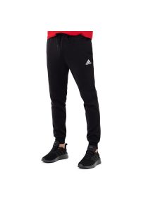 Adidas - Spodnie adidas Essentials Fleece Regular Tapered HL2236 - czarne. Kolor: czarny. Materiał: tkanina, poliester, dresówka, bawełna