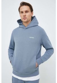 Calvin Klein bluza męska kolor niebieski z kapturem gładka. Typ kołnierza: kaptur. Kolor: niebieski. Materiał: dzianina. Wzór: gładki