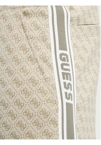 Guess Spodnie dresowe Z5BB19 K2042 Beżowy Regular Fit. Kolor: beżowy. Materiał: syntetyk