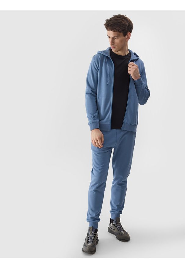 4f - 4F Spodnie dresowe joggery męskie - niebieskie XL. Kolor: niebieski. Materiał: dresówka. Wzór: gładki, jednolity, ze splotem