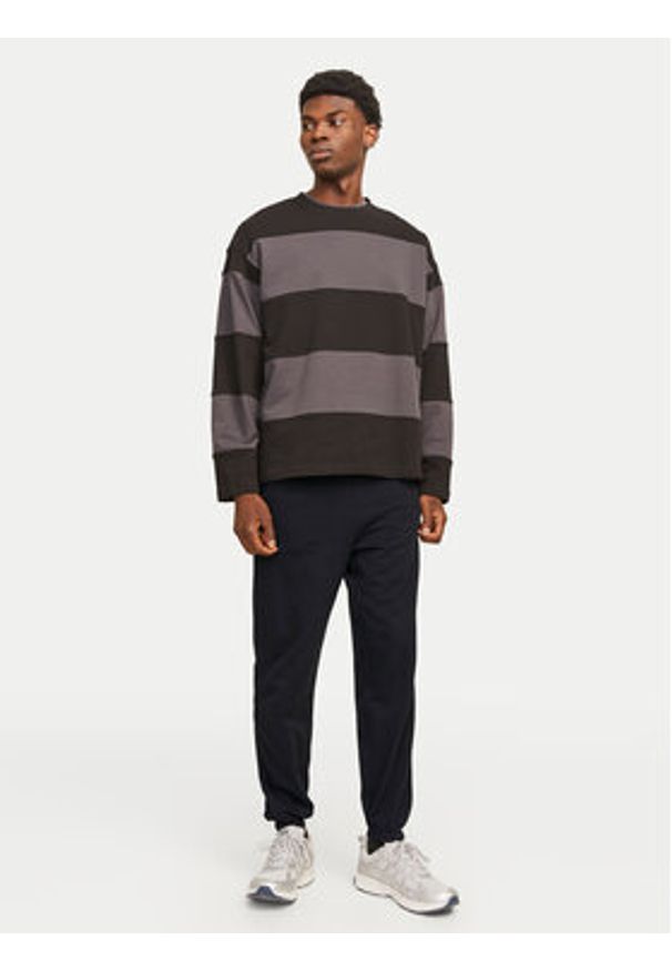 Jack & Jones Spodnie dresowe Morgan 12257964 Czarny Regular Fit. Kolor: czarny. Materiał: syntetyk, bawełna