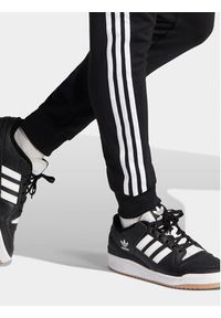 Adidas - adidas Spodnie dresowe adicolor Classics SST IL2488 Czarny Slim Fit. Kolor: czarny. Materiał: bawełna